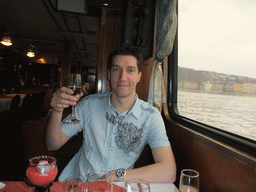Tim with wine at the cruise boat on the Danube river