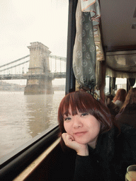 Miaomiao at the cruise boat on the Danube river, with the Széchenyi Chain Bridge