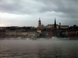 The Matthias Church, the Reformed Church of Szilágyi Dezso Tér, the Fisherman`s Bastion and cruise boats from the cruise boat on the Danube river