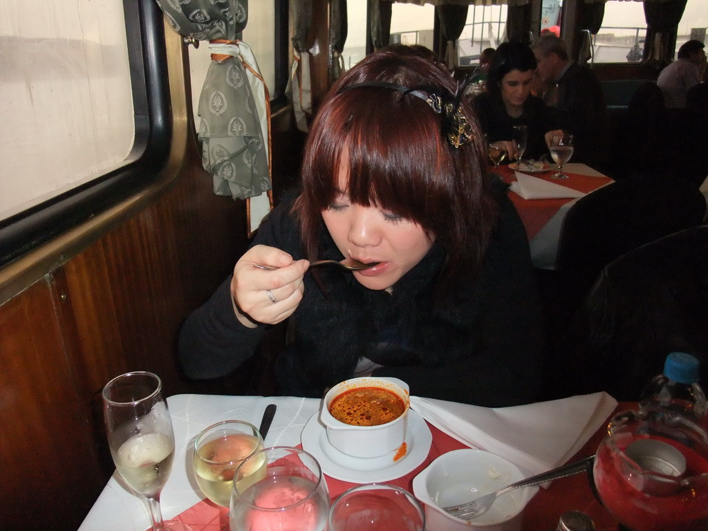 Miaomiao eating goulash soup at the cruise boat on the Danube river