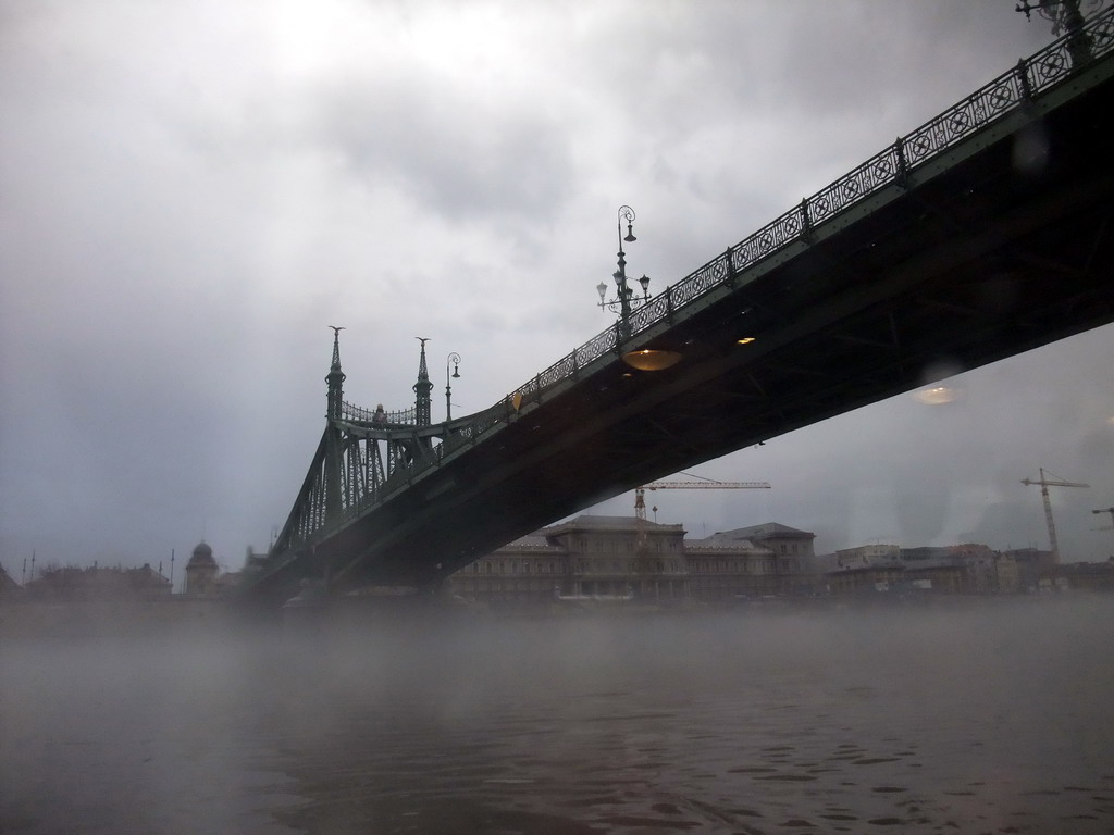 Liberty Bridge (Szabadság Híd) in the myst, from the cruise boat on the Danube river