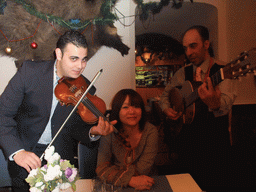 Miaomiao with gipsy musicians in the restaurant `Fekete Holló`