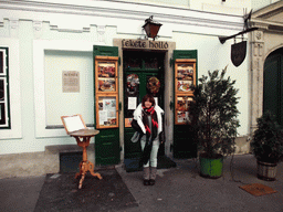 Miaomiao in front of the restaurant `Fekete Holló`