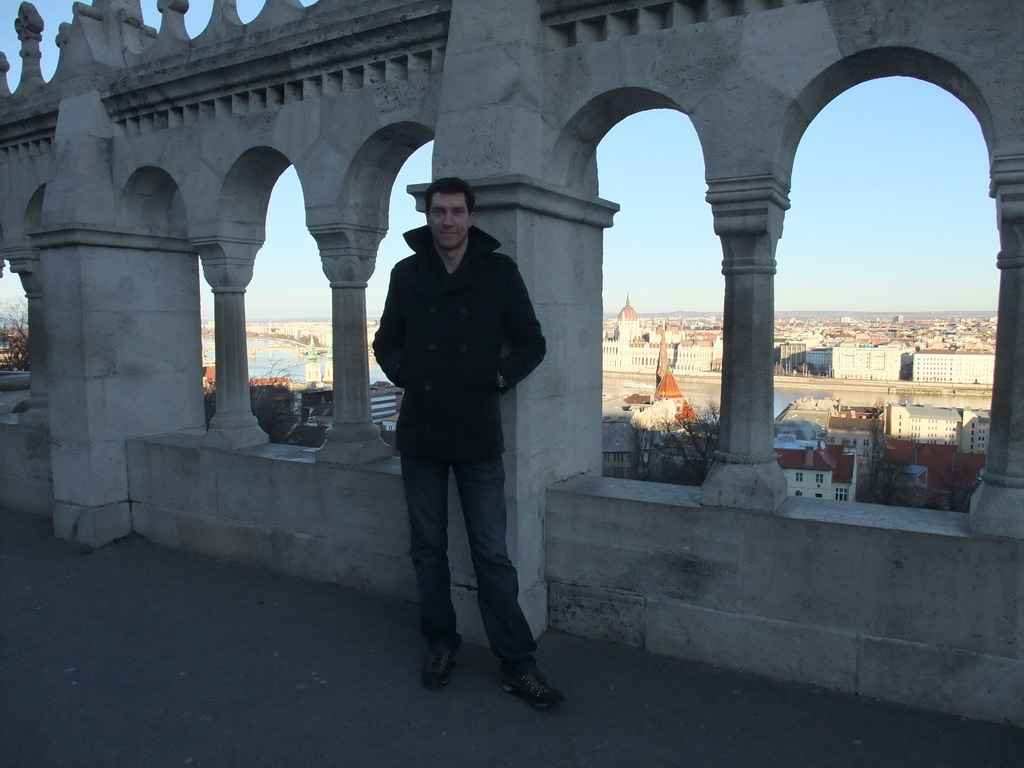 Tim at the Fisherman`s Bastion, with view on the Hungarian Parliament Building, the Reformed Church of Szilágyi Dezso Tér and the Danube river