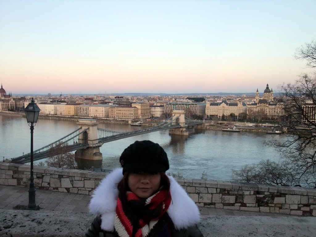 Miaomiao with the Hungarian Parliament Building, the Széchenyi Chain Bridge over the Danube river, the Gresham Palace and Saint Stephen`s Basilica, viewed from the front of Buda Castle