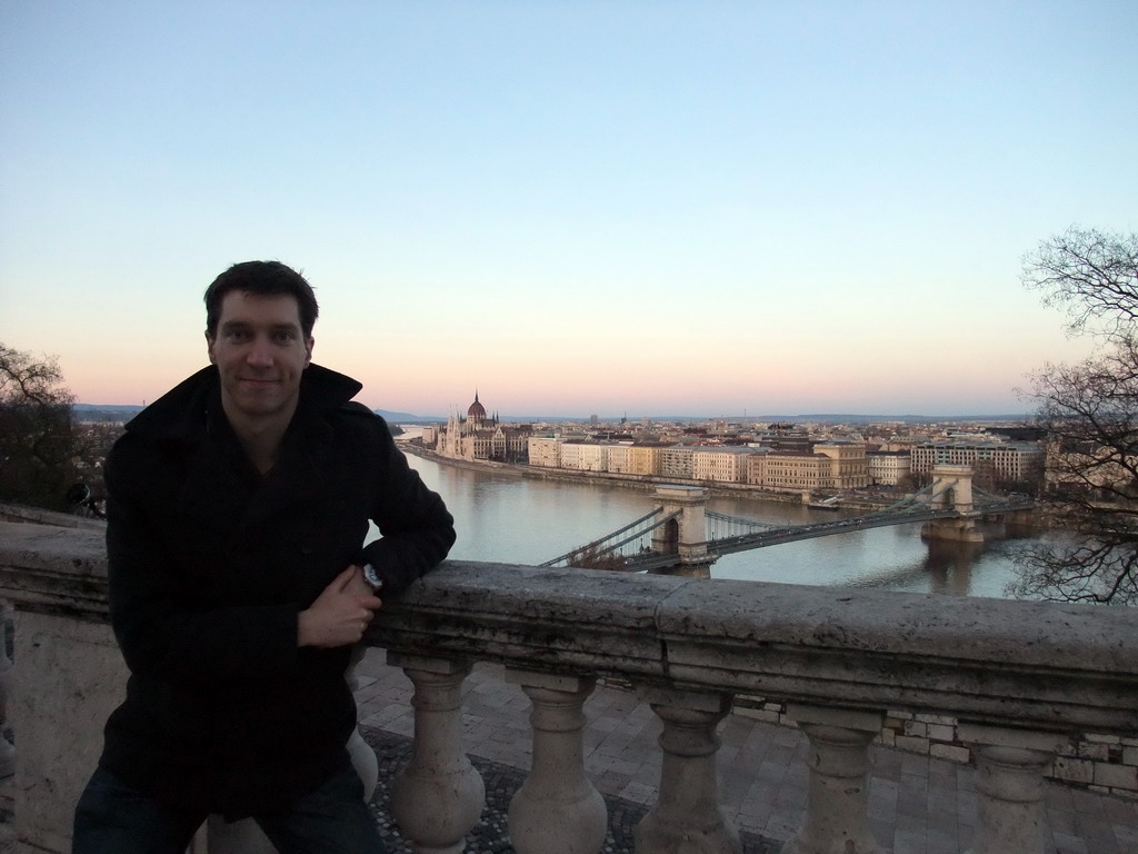 Tim with the Hungarian Parliament Building and the Széchenyi Chain Bridge over the Danube river, viewed from the front of Buda Castle