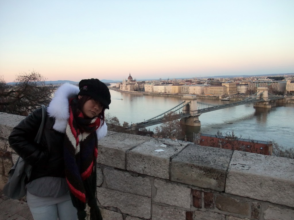 Miaomiao with the Hungarian Parliament Building and the Széchenyi Chain Bridge over the Danube river, viewed from the front of Buda Castle