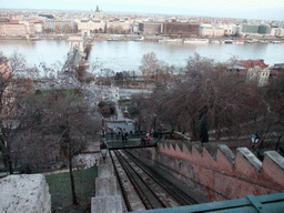 The Budapest Castle Hill Funicular with a view on the Széchenyi Chain Bridge over the Danube river, the Gresham Palace and Saint Stephen`s Basilica