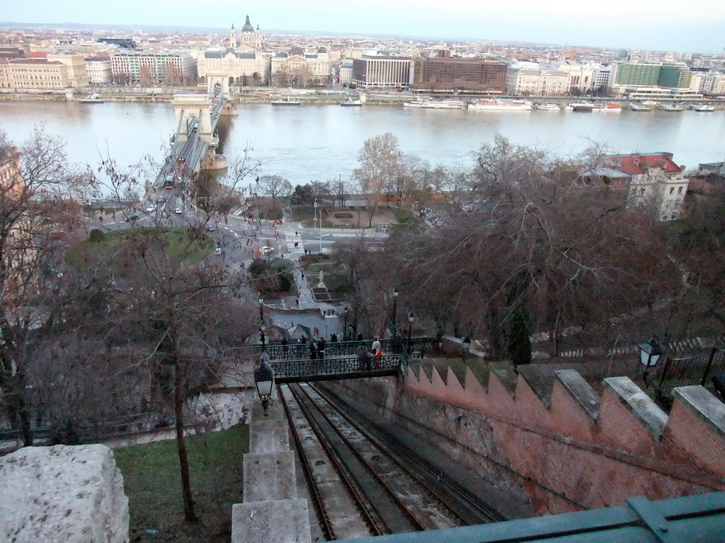 The Budapest Castle Hill Funicular with a view on the Széchenyi Chain Bridge over the Danube river, the Gresham Palace and Saint Stephen`s Basilica