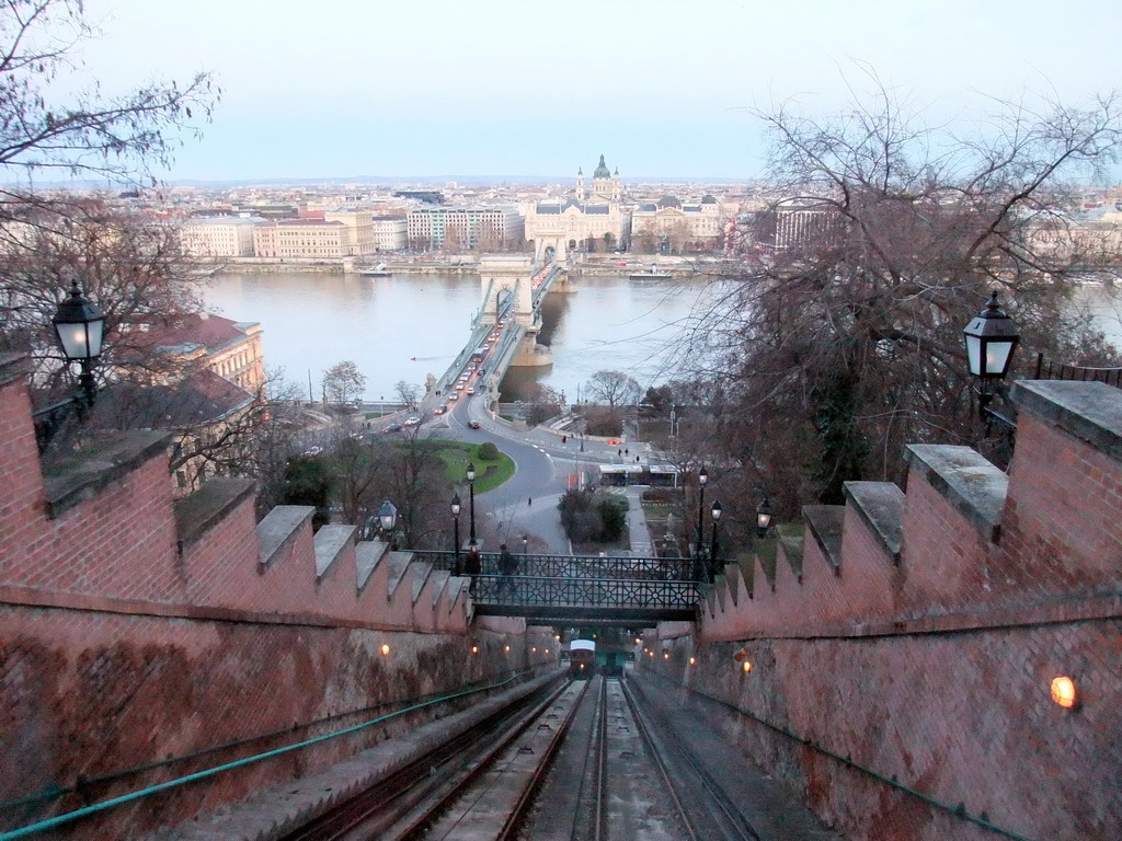 The Budapest Castle Hill Funicular with a view on the Széchenyi Chain Bridge over the Danube river, the Gresham Palace and Saint Stephen`s Basilica