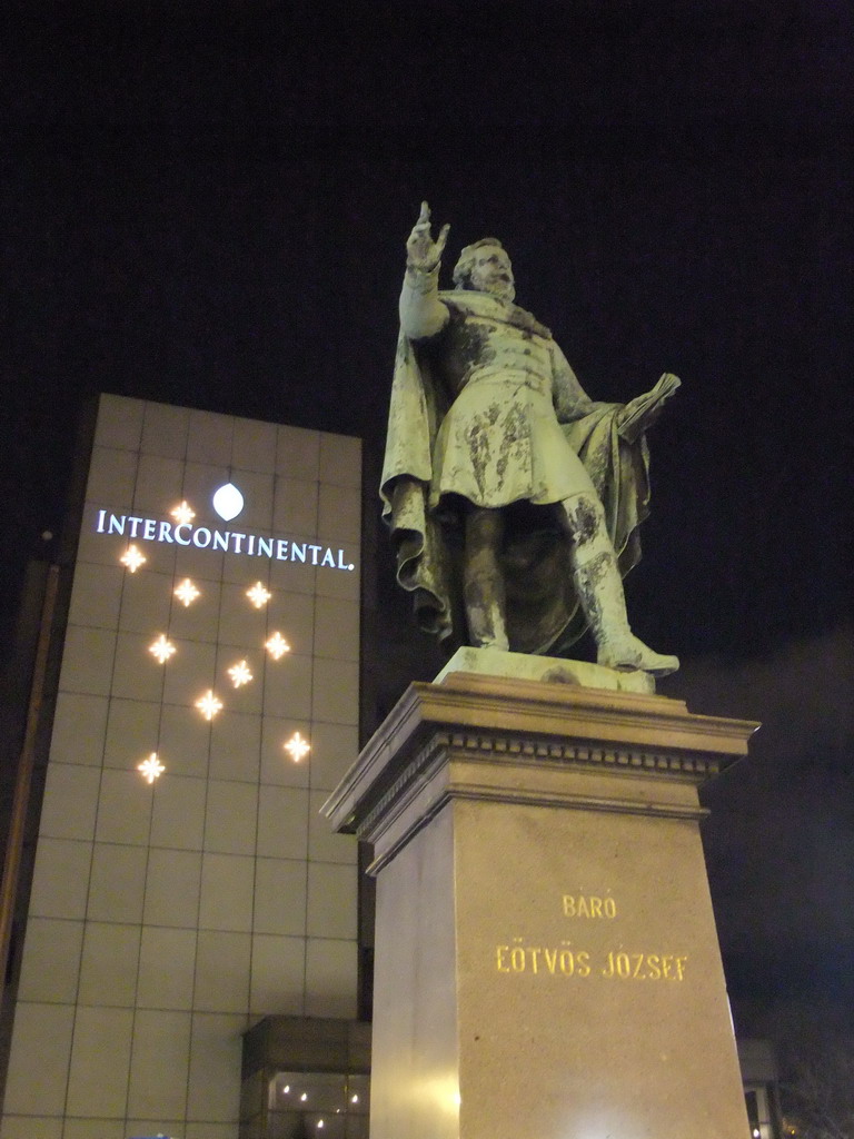 Statue of Baron József Eötvös in front of the Hotel Intercontinental Budapest at Roosevelt Tér square, by night