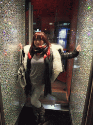 Miaomiao at the entrance of a jewelry shop in Vaci Utca street, by night