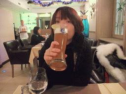 Miaomiao with beer in our dinner restaurant in Vaci Utca street