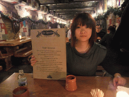 Miaomiao with the menu card in the restaurant `Sir Lancelot`