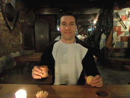 Tim with bread and drink in the restaurant `Sir Lancelot`