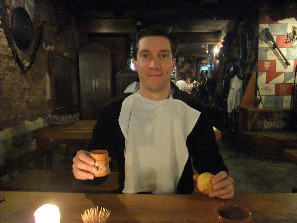 Tim with bread and drink in the restaurant `Sir Lancelot`