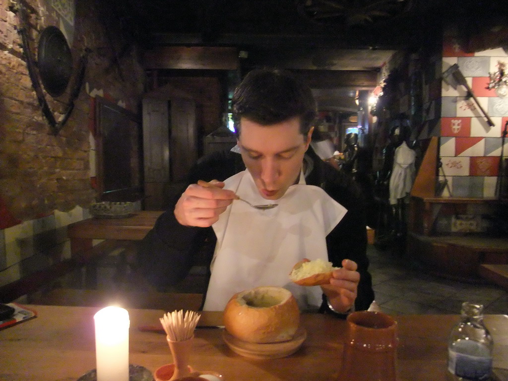 Tim with soup in the restaurant `Sir Lancelot`