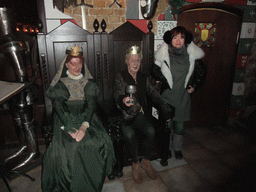 Miaomiao with two wax statues in the restaurant `Sir Lancelot`