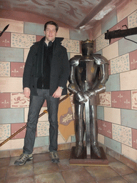 Tim with a knight`s armour in the restaurant `Sir Lancelot`