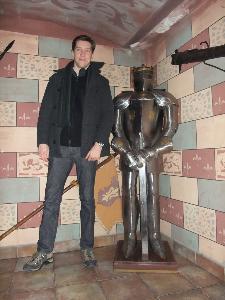 Tim with a knight`s armour in the restaurant `Sir Lancelot`