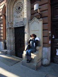 Miaomiao at the throne in front of the restaurant `Sir Lancelot`