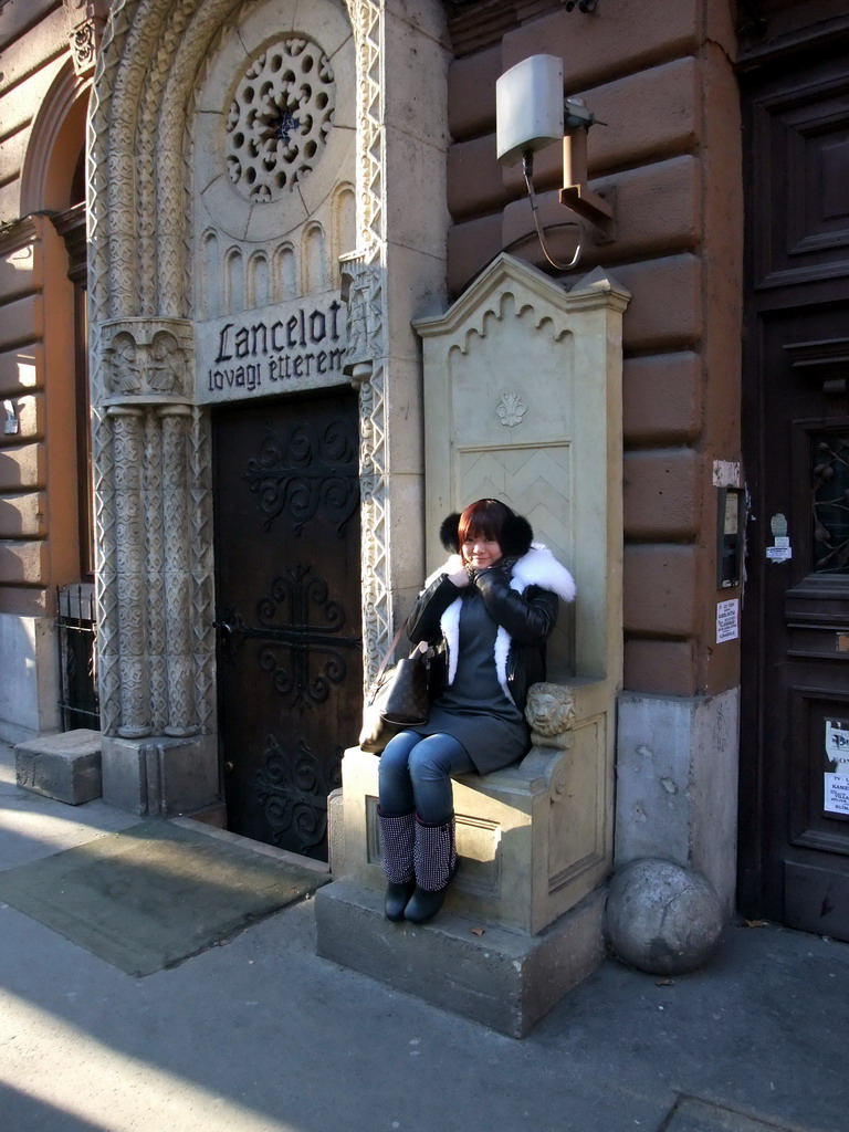 Miaomiao at the throne in front of the restaurant `Sir Lancelot`