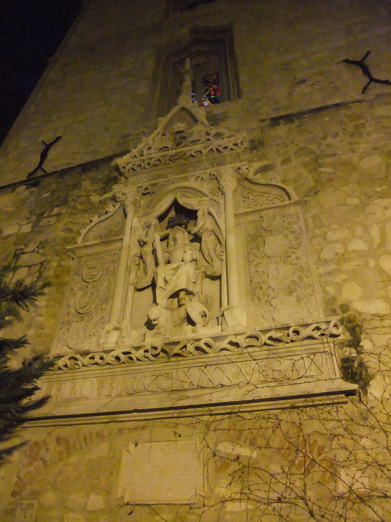 Medieval carving in a building at the east side of Táncsics Mihály Utca street