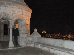 Tim at the Fisherman`s Bastion, with view on the Széchenyi Chain Bridge over the Danube river, the Gresham Palace and Saint Stephen`s Basilica, by night