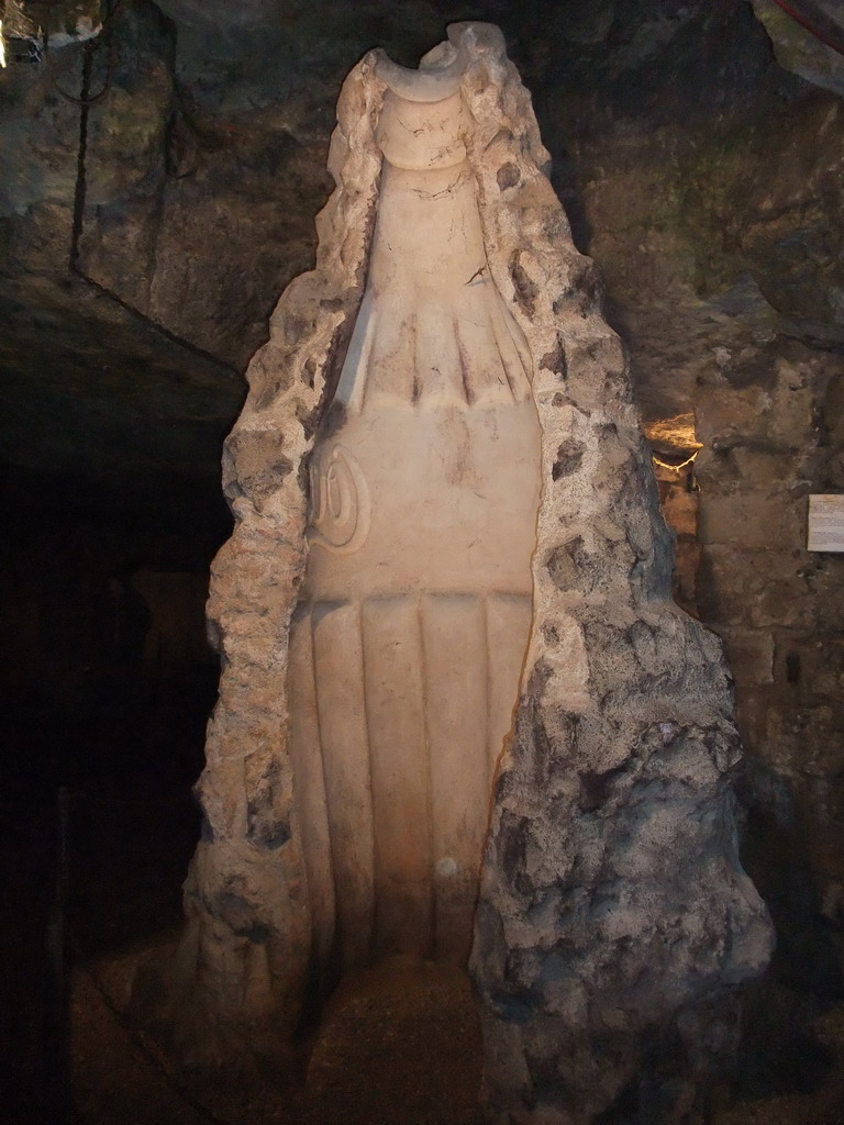 Stonce carving of a Coca-Cola bottle in the Labyrinth of Buda Castle