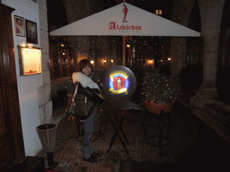 Miaomiao at the sign of restaurant `Alabárdos`, by night