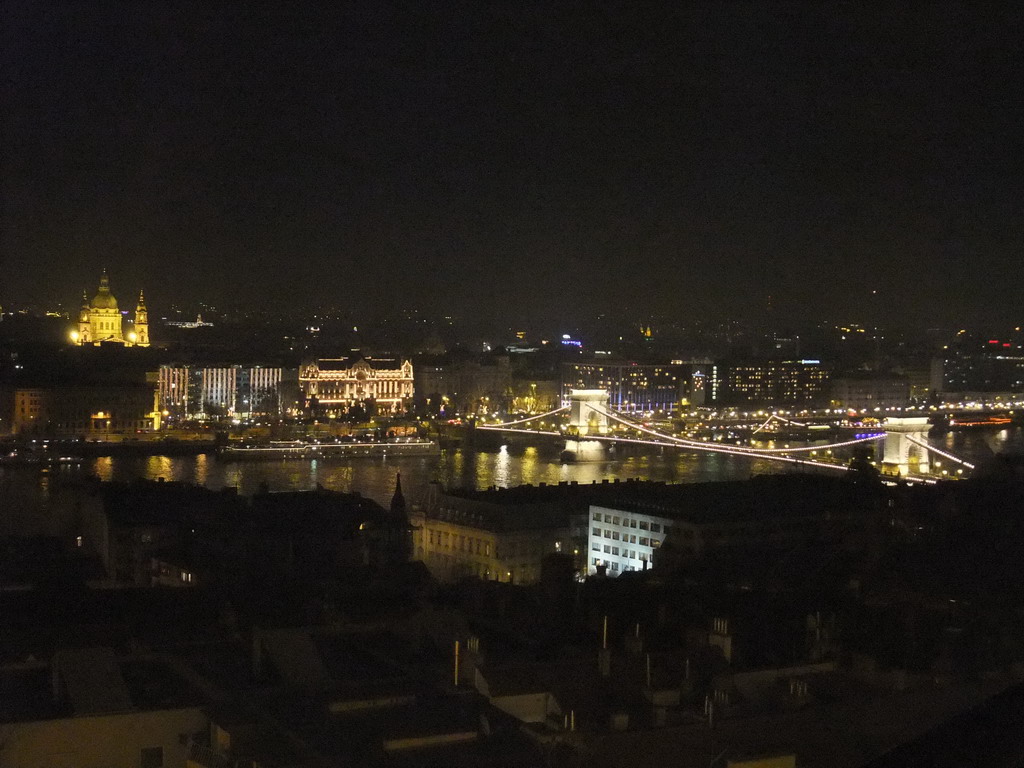 The Széchenyi Chain Bridge over the Danube river, the Gresham Palace and Saint Stephen`s Basilica, viewed from the Fisherman`s Bastion, by night