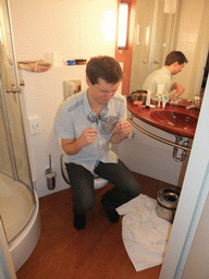 Tim on the toilet of our room in Star Inn Hotel