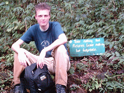 Tim`s friend with a sign at the slopes of Mount Cameroon