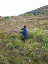 Our tour guide carrying a branch at the slopes of Mount Cameroon