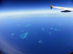 The Hopkinson Reef, the Backnumbers Reef, the Braggs Reef, the Lodestone Reef, the John Brewer Reef, the Arab Reef, the Fore and Aft Reef, the Roxburgh Reef, the Kelso reef, the Little Kelso Reef and the Rib Reef of the Great Barrier Reef, viewed from the airplane from Brisbane