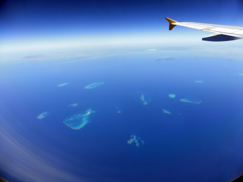 The Hopkinson Reef, the Backnumbers Reef, the Braggs Reef, the Lodestone Reef, the John Brewer Reef, the Arab Reef, the Fore and Aft Reef, the Roxburgh Reef, the Kelso reef, the Little Kelso Reef and the Rib Reef of the Great Barrier Reef, viewed from the airplane from Brisbane
