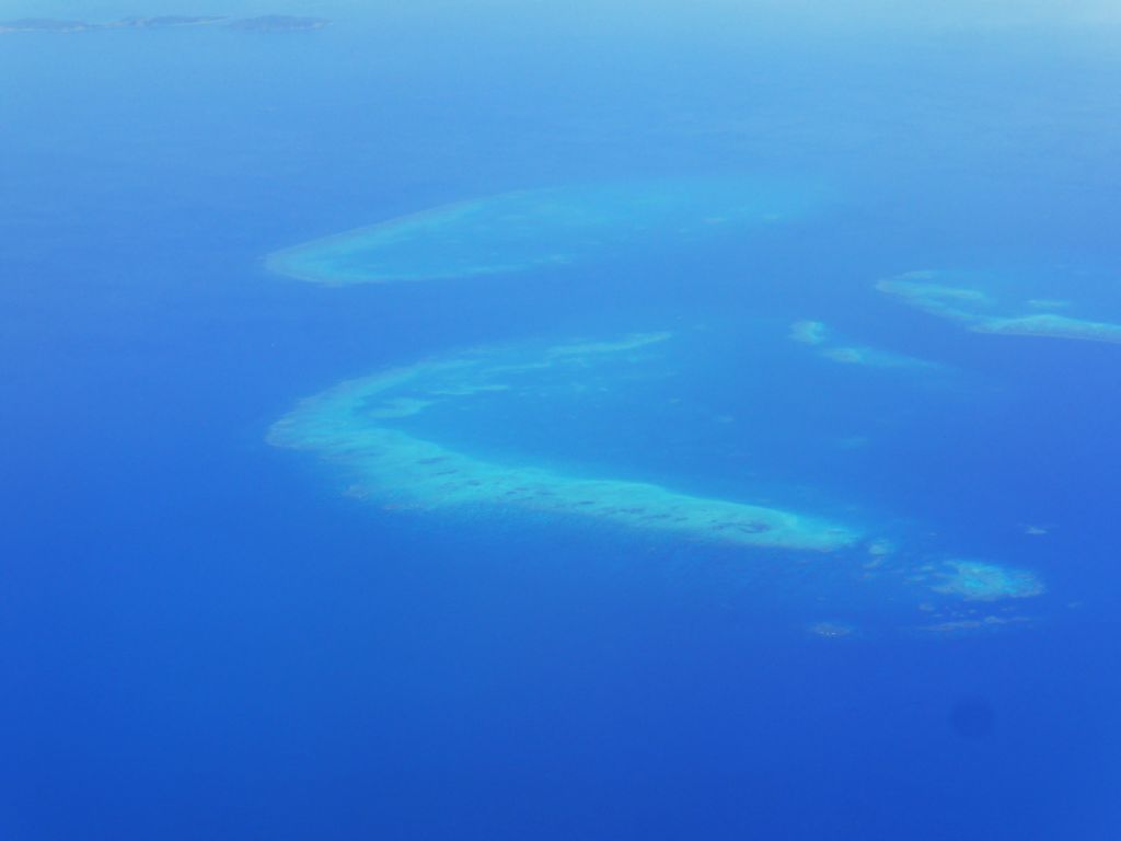 The Trunk Reef, the Bramble Reef and the Walker Reef of the Great Barrier Reef, viewed from the airplane from Brisbane