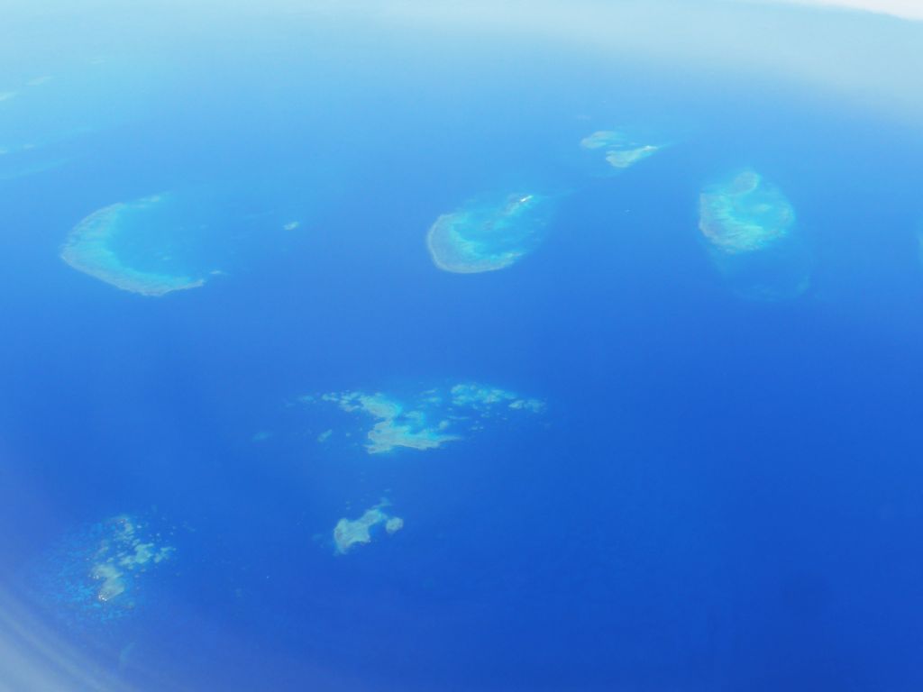 The Noreaster Reef, the Yamacutta Reef, the Taylor Reef, the Beaver Reef and the Farquharson Reef of the Great Barrier Reef, viewed from the airplane from Brisbane