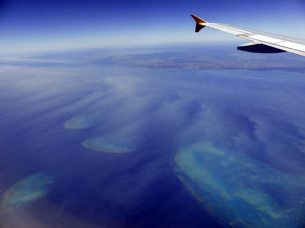 The Cayley Reef, the Feather Reef, the Peart Reef and the Howie Reef of the Great Barrier Reef, viewed from the airplane from Brisbane