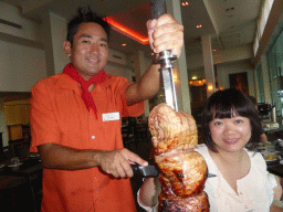Miaomiao getting meat during the Churrasco Experience dinner at the Bushfire Flame Grill restaurant at the Cairns Esplanade