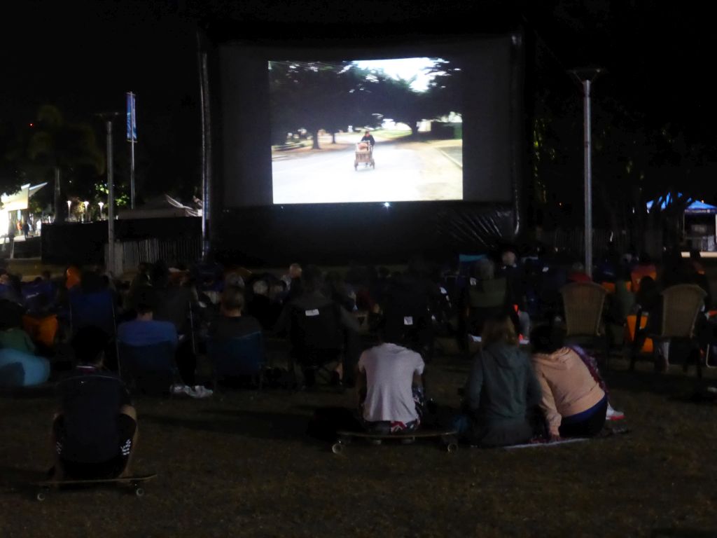 Outdoor cinema at the Cairns Esplanade Western Event Lawn, by night