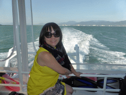 Miaomiao at our Seastar Cruises tour boat, with a view on Trinity Bay and the skyline of Cairns