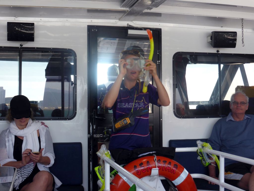 Crew on the Seastar Cruises tour boat explaining the snorkeling equipment