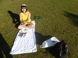 Miaomiao eating shrimps on the grass at the east side of the Cairns Lagoon swimming pool at the Cairns Esplanade