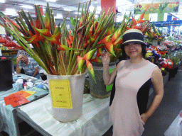 Miaomiao with flowers at Rusty`s Markets at Spence Street