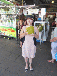 Miaomiao with a coconut at Rusty`s Markets at Spence Street