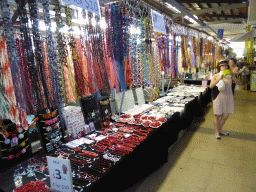 Miaomiao with a coconut and jewelry at Rusty`s Markets at Spence Street