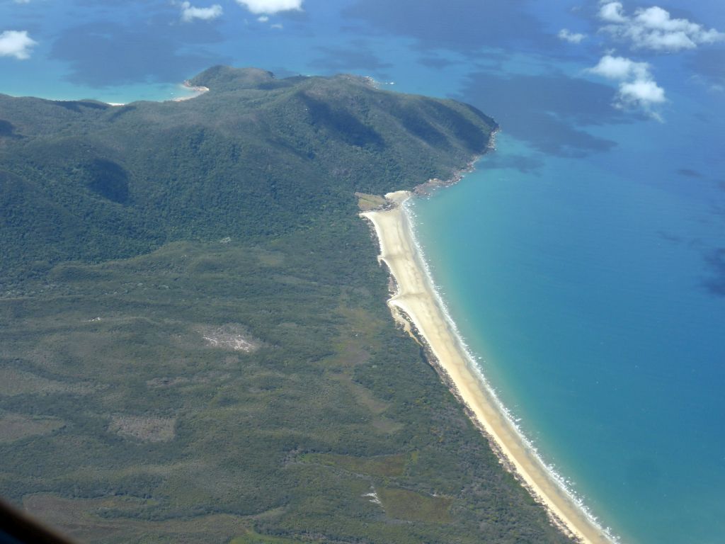 Beach at the coastline west of the Fitzroy Island, viewed from the airplane to Sydney