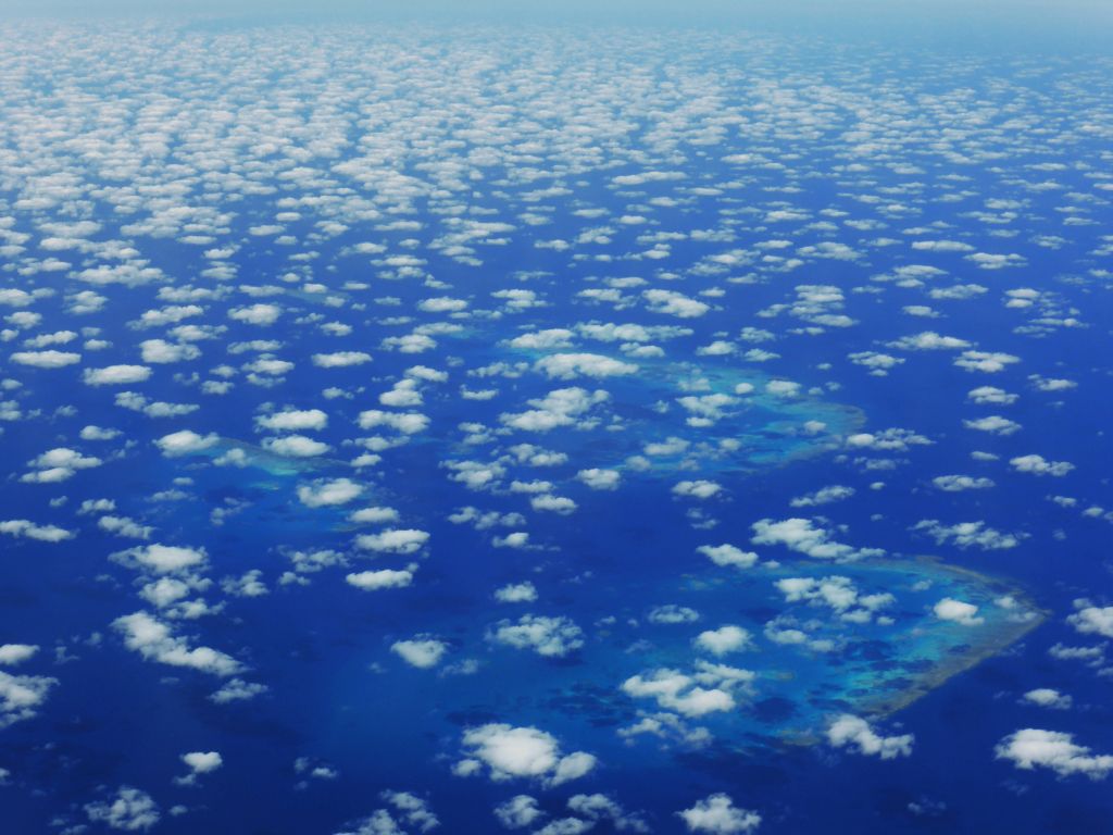 The Walker Reef, the Bramble Reef and the Trunk Reef of the Great Barrier Reef, viewed from the airplane to Sydney