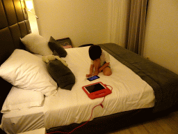 Max playing with iPhone in our bedroom at the Prinsotel Alba Hotel Apartamentos